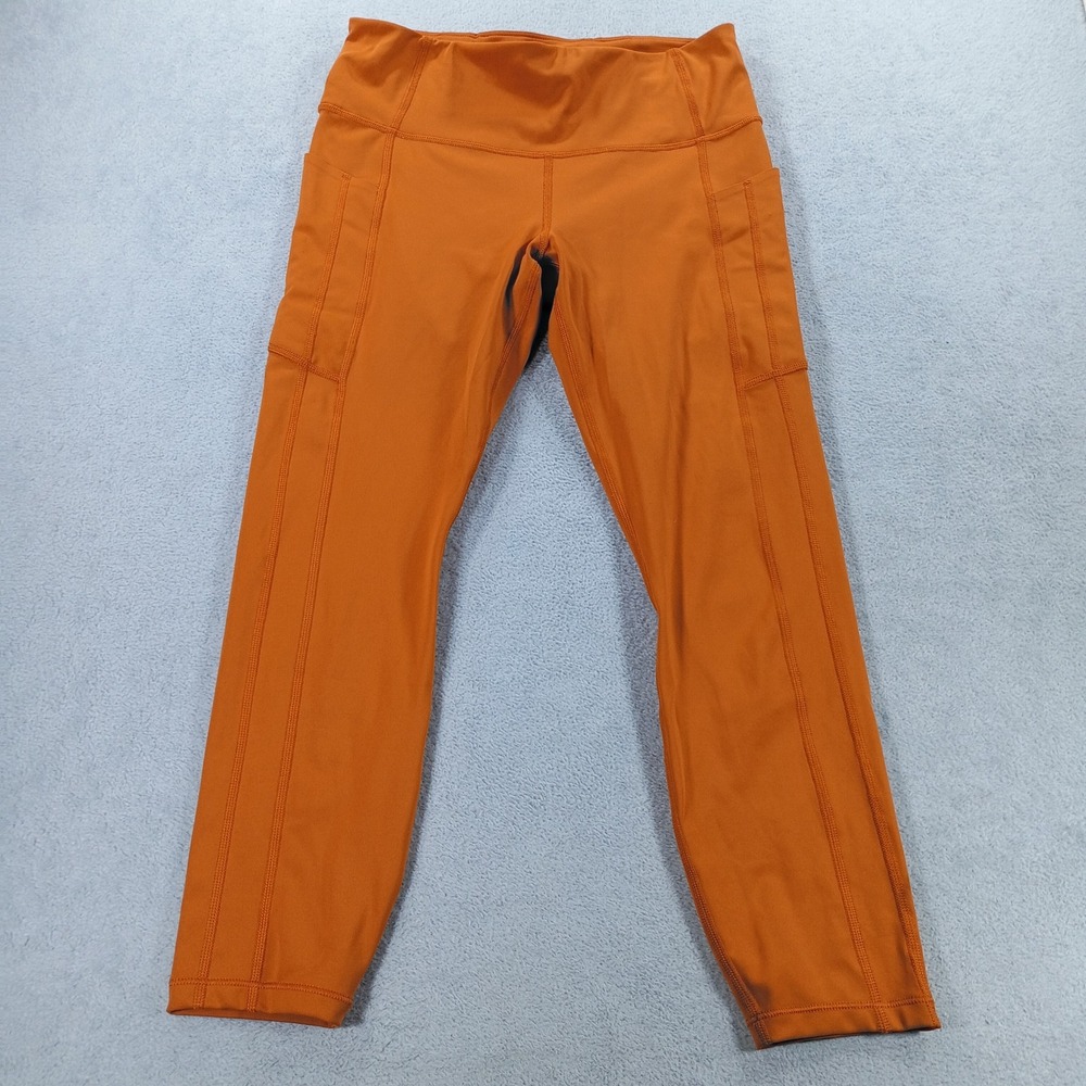 Athleta Womens Ultimate Stash 7/8 Tight Orange Medium Pockets